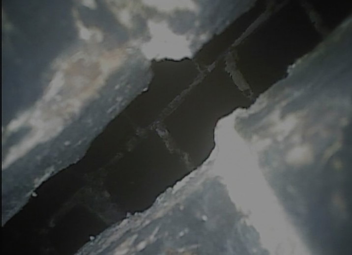 Gaps in a chimney where the mortar used to be